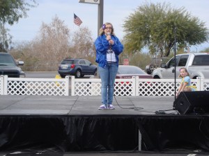 Taylor announcing Cinderella sisters as they perform their talents